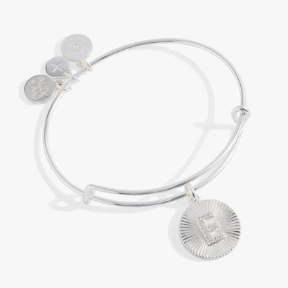 Initial E pave starburst texture bangle by Alex and Ani on silver bracelet with three charms on Tampa Home & Garden Store