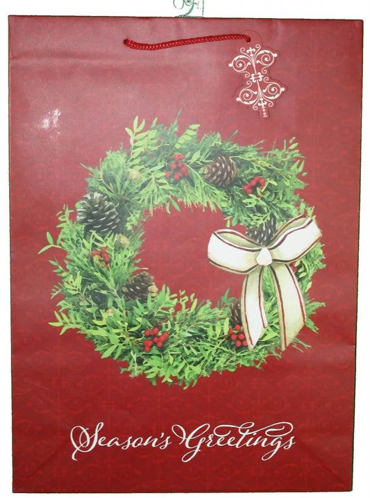 Gift bag Paper Season's Greeting Wreath with greenery and white bow on red background on Tampa Home & Garden Store