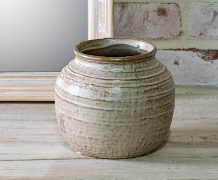 Milky beige ceramic vase with round, ribbed body and aged glaze on Tampa Home & Garden Store