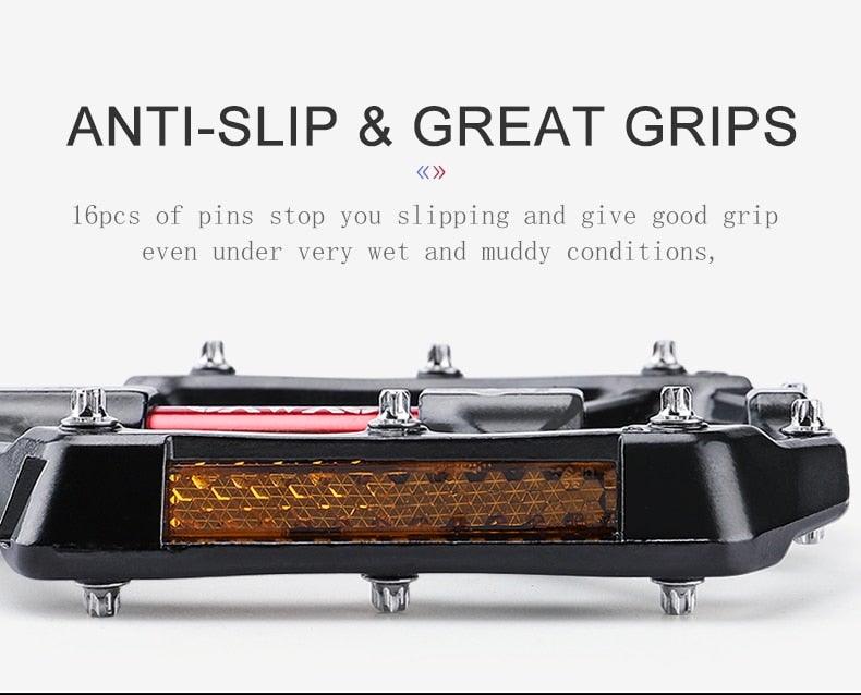 Aluminum bicycle pedal with anti-slip grip, black flat platform, metal pins and amber reflector on Tampa Home & Garden Store