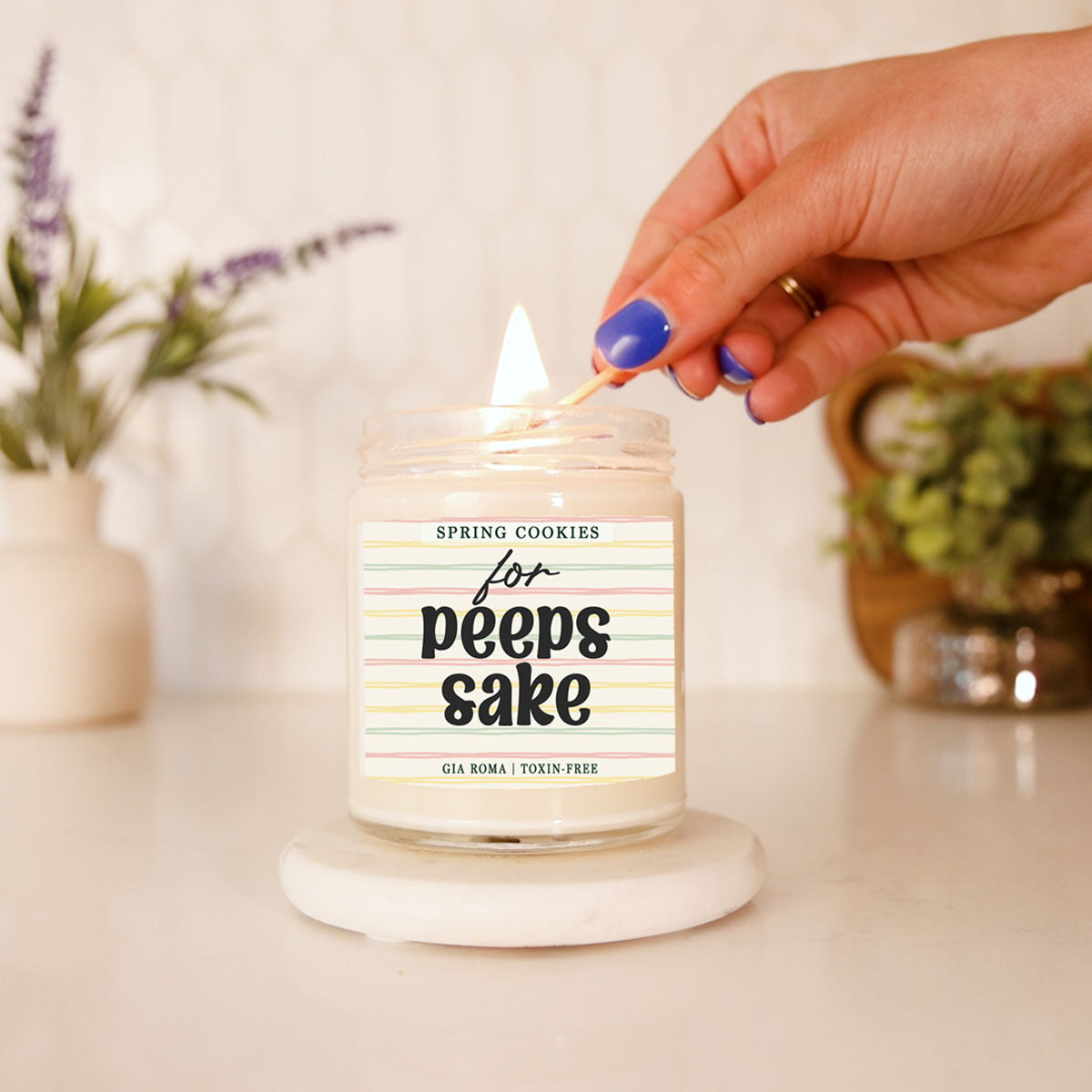 Easter Cookie Candle Gia Roma in a clear glass jar with pastel striped label lighting wick on Tampa Home & Garden Store