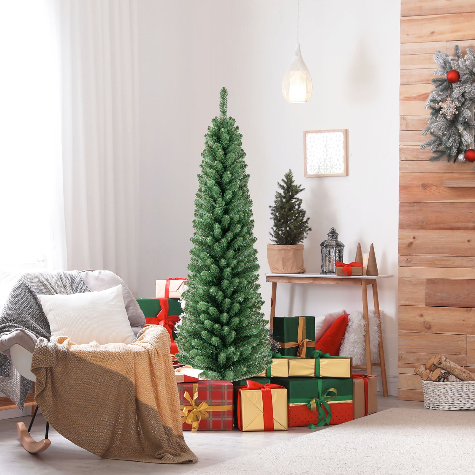 Pencil Christmas Tree, tall green artificial tree with memory wire tips, shown with wrapped gifts on Tampa Home & Garden Store