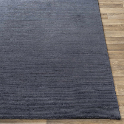 Philipsburg Carpet rug in blue-gray with ribbed texture by Boutique Rugs on hardwood floor on Tampa Home & Garden Store