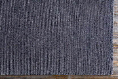 Philipsburg Carpet rug by Boutique Rugs in dark charcoal ribbed texture on wood floor on Tampa Home & Garden Store