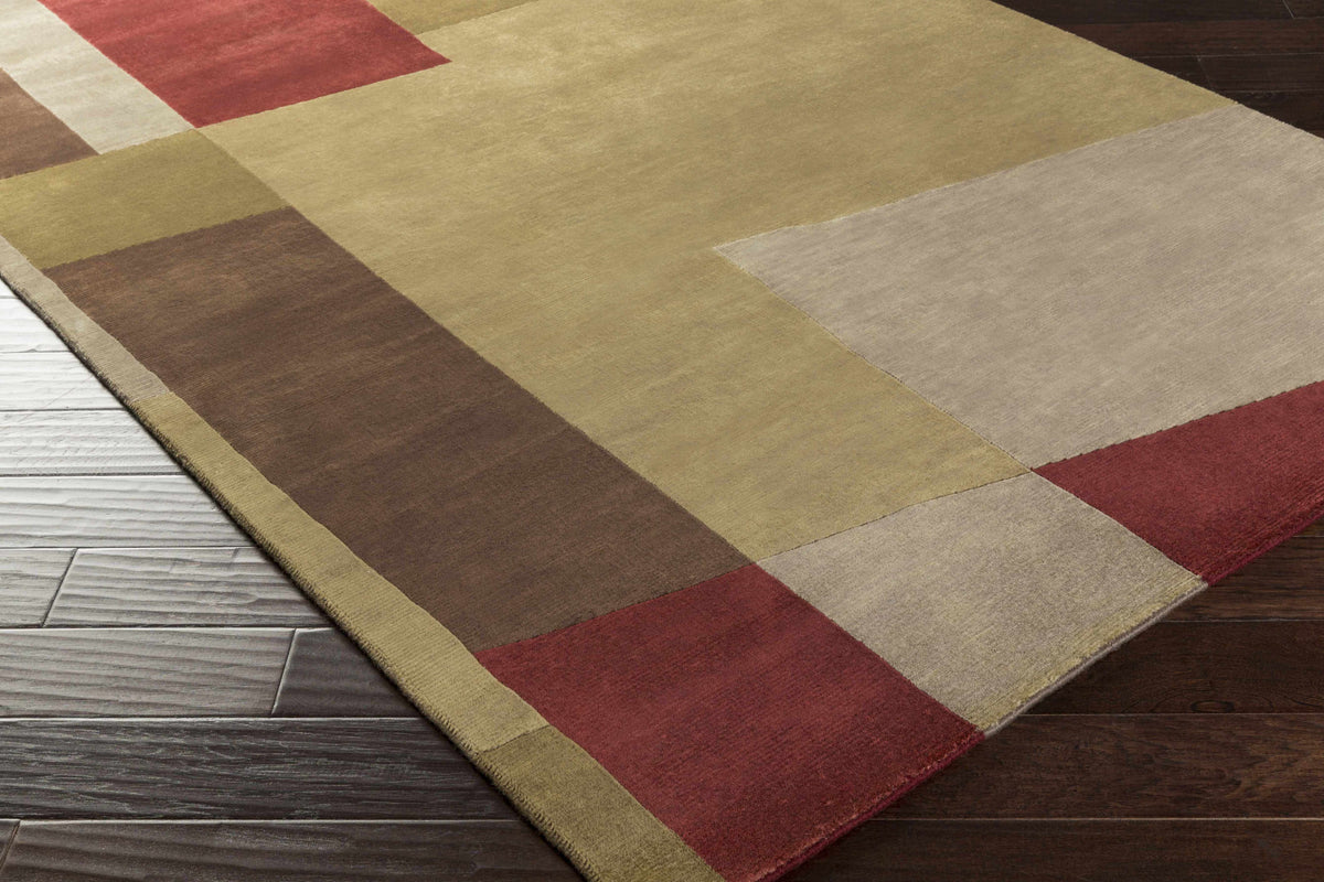 Piedra Premium Wool Area Rug by Boutique Rugs with patchwork in gold beige brown red on Tampa Home & Garden Store