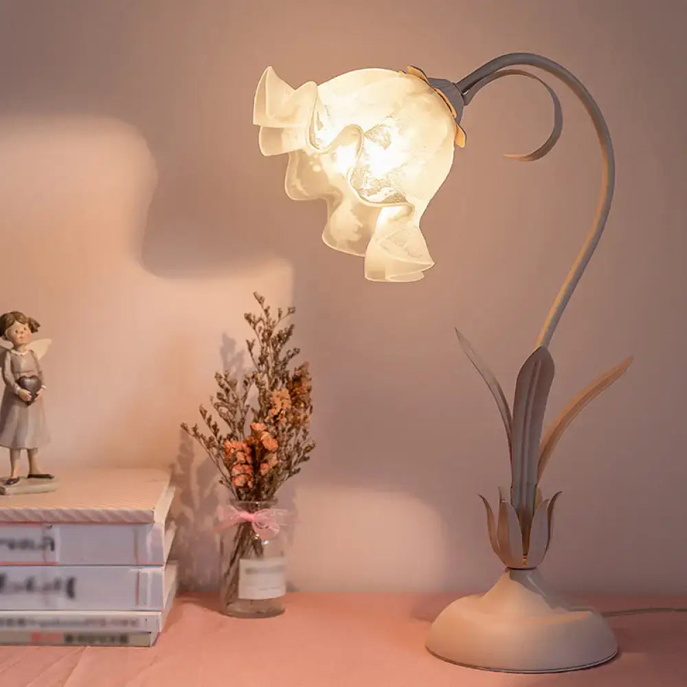 Pink Lily Glass Lamp by Decorbites, pink lily glass shade atop a leaf-inspired base on Tampa Home & Garden Store