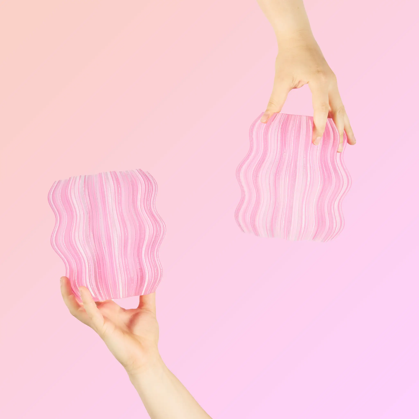 Mini Wavy Lamp for Ambient Atmosphere pink striped base, Wooj Design table lamp held by hand on Tampa Home & Garden Store