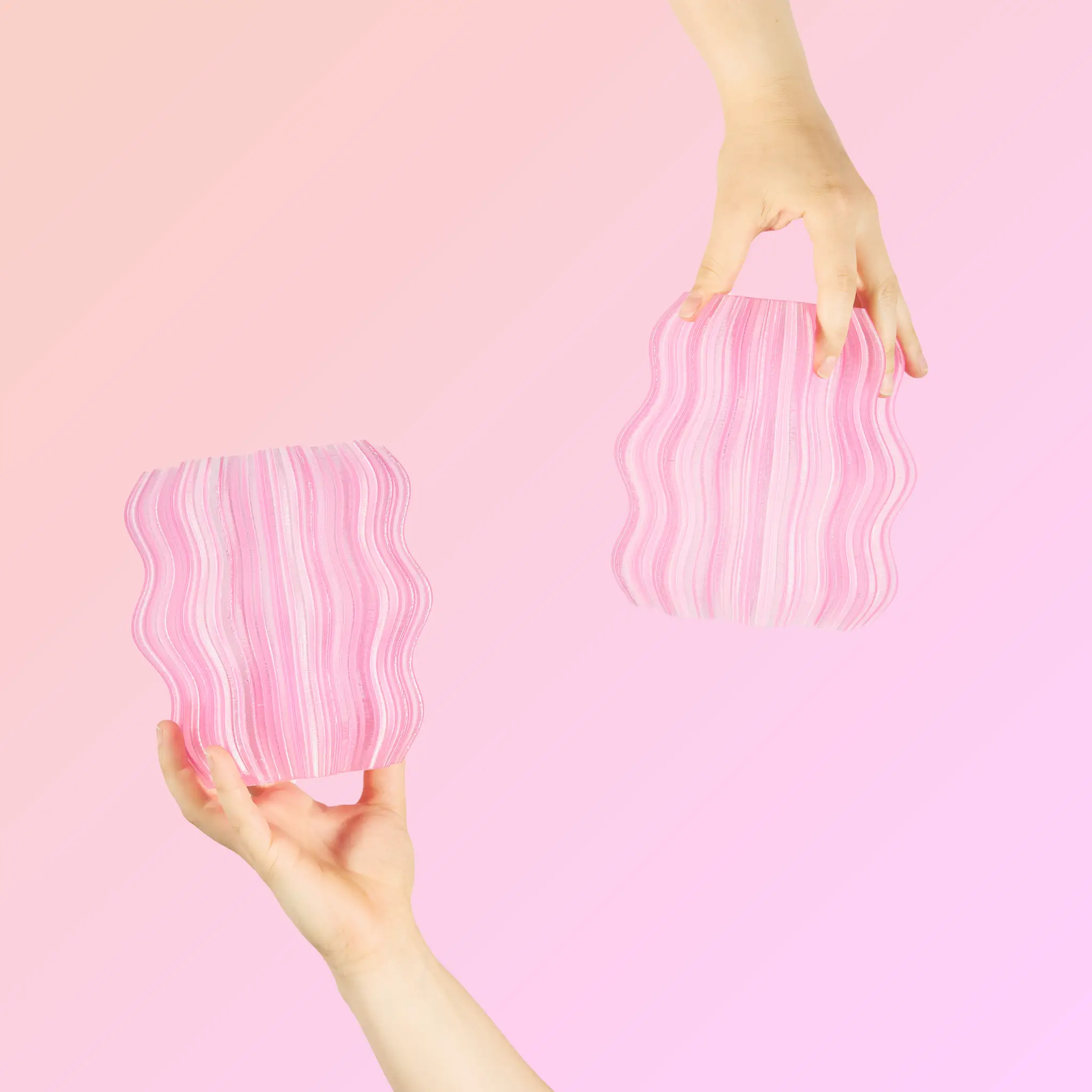 Mini Wavy Lamp for Ambient Atmosphere pink striped base, Wooj Design table lamp held by hand on Tampa Home & Garden Store