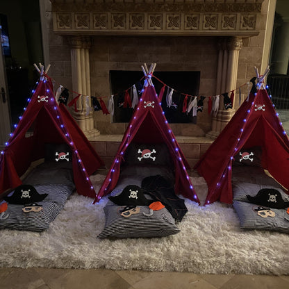 Pirate Sleepover Tent Set for 3; red teepees with skull icons, striped cushions, blue lights on Tampa Home & Garden Store
