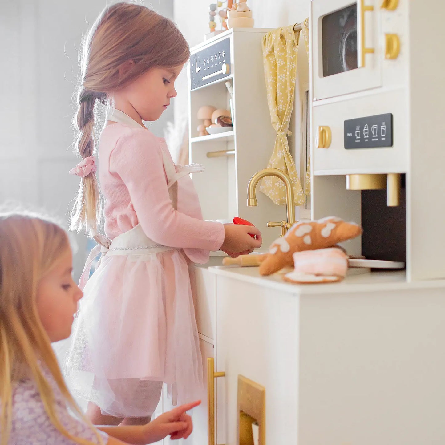 Tiny Land Iconic Wooden Play Kitchen cream color with brass fixtures and pretend foods on Tampa Home & Garden Store
