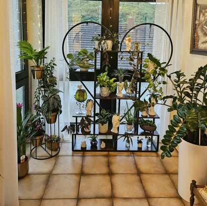 Black heart flower rack by Decorbites with tiered black metal shelves and assorted potted plants on Tampa Home & Garden Store