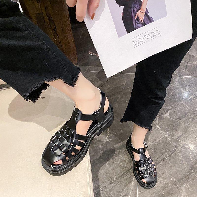 Stevvex platform women's sandals, black upper with buckle strap, open toe, thick sole, pair on Tampa Home & Garden Store