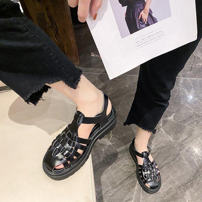 Stevvex platform women's sandals, black upper with buckle strap, open toe, thick sole, pair on Tampa Home & Garden Store