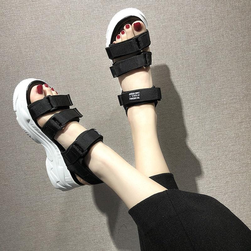 Stevvex platform sandals pair with black straps and chunky white sole, open toe, red nails on Tampa Home & Garden Store