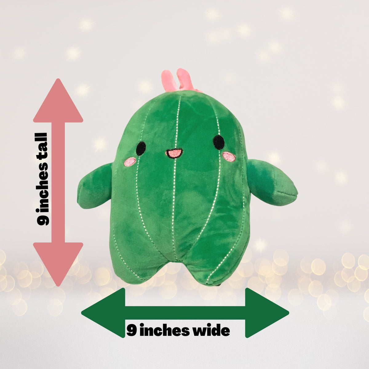 Plush cactus pillow toy, green stuffed animal with pink top and face, 9 inches wide on Tampa Home & Garden Store