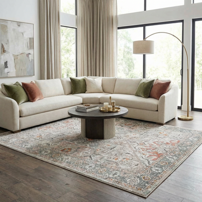 Bolinas Area Rug by Boutique Rugs, blue-gray patterned rug under coffee table in a bright living room on Tampa Home & Garden Store