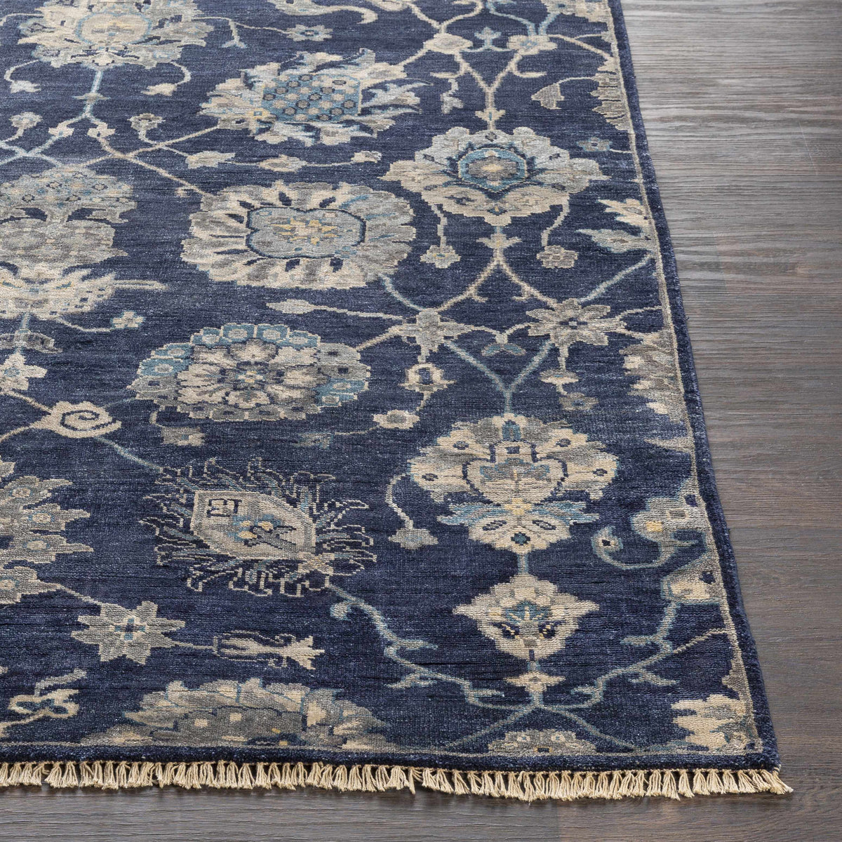 Pinetop Premium Rug by Boutique Rugs in navy blue with ivory floral motifs and fringe on Tampa Home & Garden Store