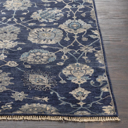 Pinetop Premium Rug by Boutique Rugs in navy blue with ivory floral motifs and fringe on Tampa Home & Garden Store