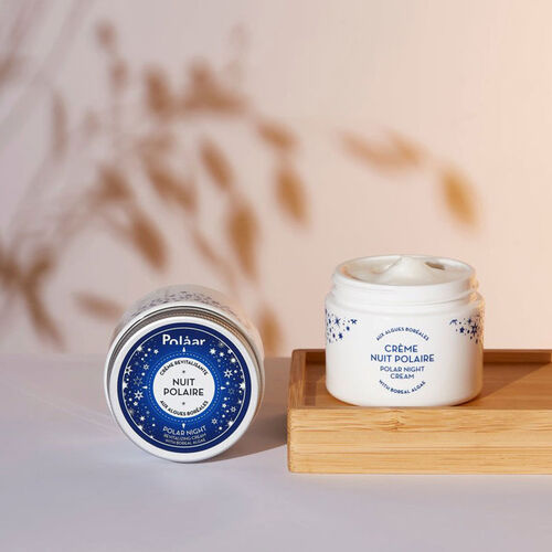Two Polaar night cream jars with Boreal Algae: blue tin and white jar on wooden tray on Tampa Home & Garden Store