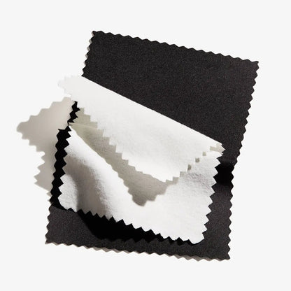 Jewelry polishing cloth white microfiber with pinked edges atop black fabric, Alex and Ani on Tampa Home & Garden Store