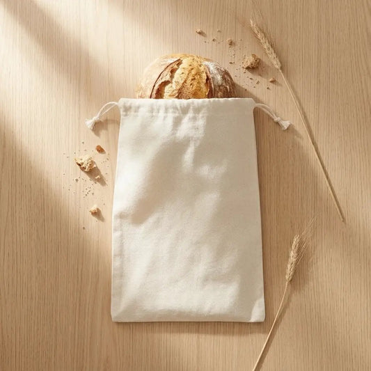 Natural linen bread bag 4-pack with drawstring closure by Organic Cotton Mart, loaf visible on Tampa Home & Garden Store