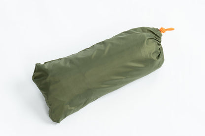Poncho Rain Fly Tarp in olive green stuff sack with orange drawcord on Tampa Home & Garden Store
