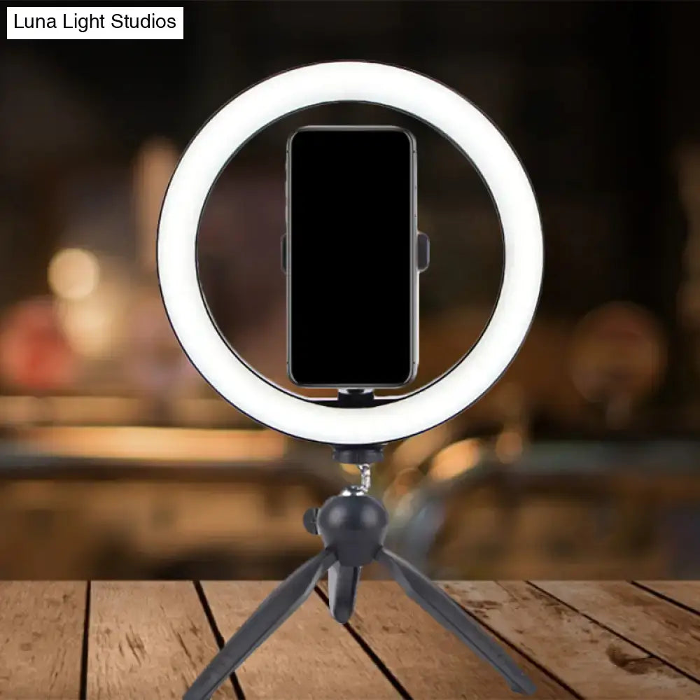 Black metal tripod ring light with smartphone holder by Decorbites on Tampa Home & Garden Store
