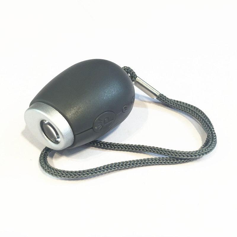 Mini projection clock key chain by Stevvex, black oval body, braided cord on Tampa Home & Garden Store