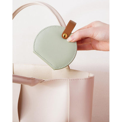 Portable mini travel jewelry box by Shaketea, mint green round case with tan leather strap on Tampa Home & Garden Store