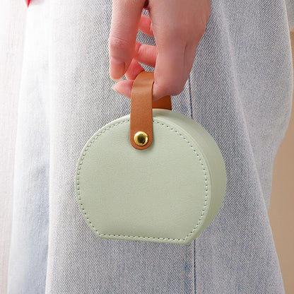 Portable jewelry storage box, round mint green case with tan leather strap by Shaketea on Tampa Home & Garden Store