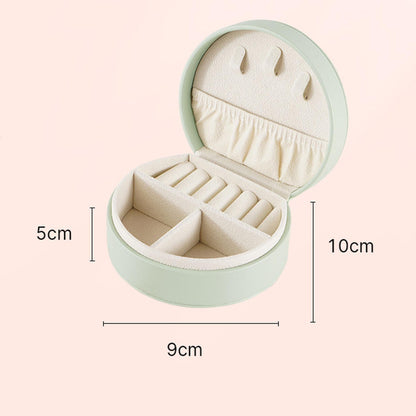 Portable travel jewelry box, mint-green round organizer with padded interior and ring slots on Tampa Home & Garden Store