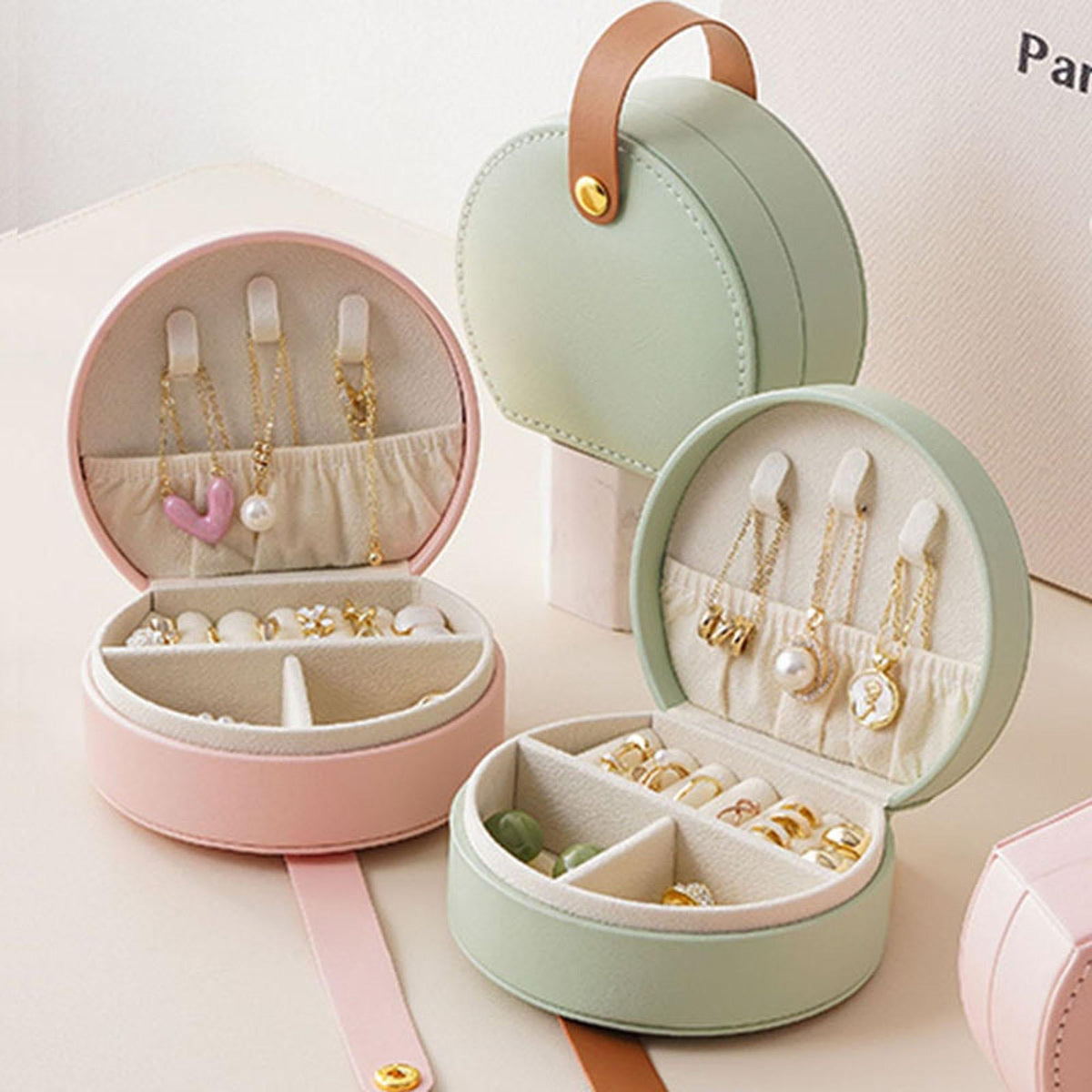 Mini travel jewelry box organizer by Shaketea, pastel mint round case with tan strap on Tampa Home & Garden Store