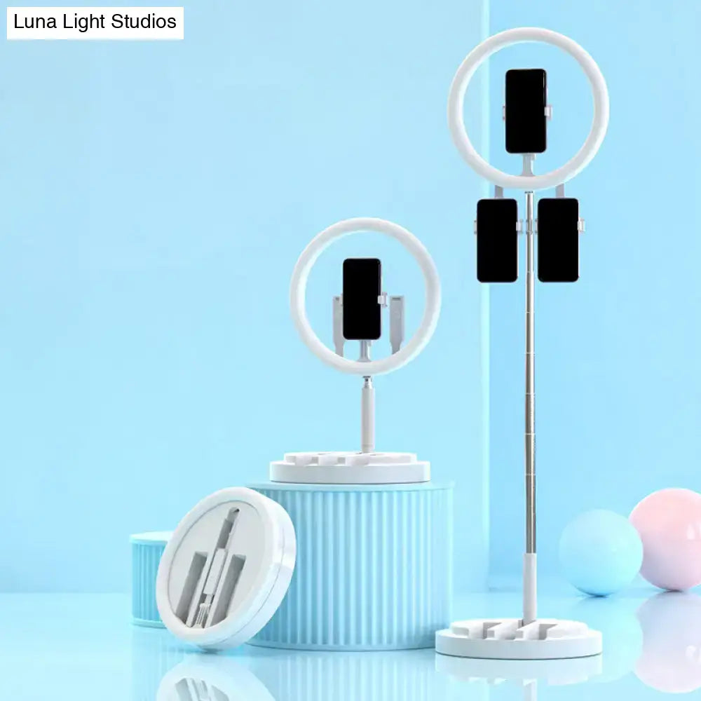 Two pink metal ring lights with phone mounts on stands by Decorbites on Tampa Home & Garden Store
