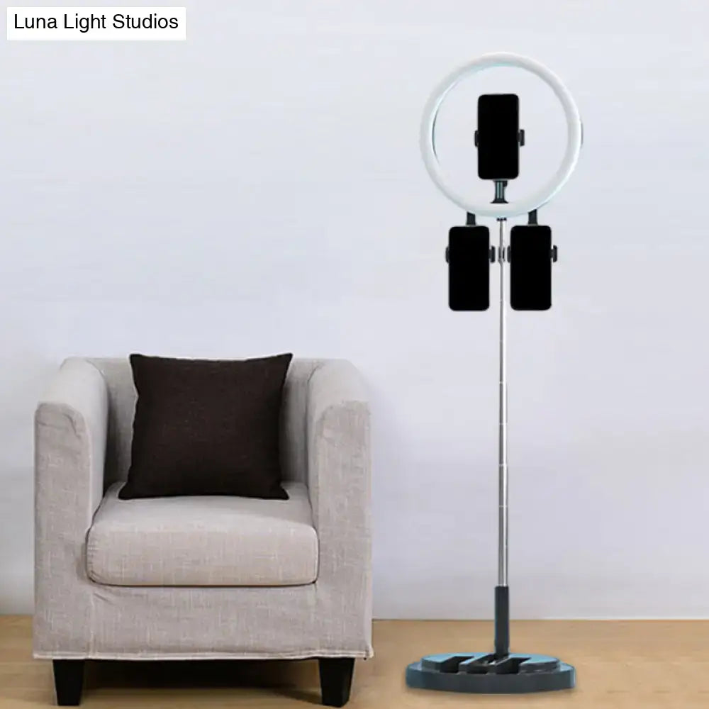 Pink metal ring light with three phone mounts on a stand on Tampa Home & Garden Store
