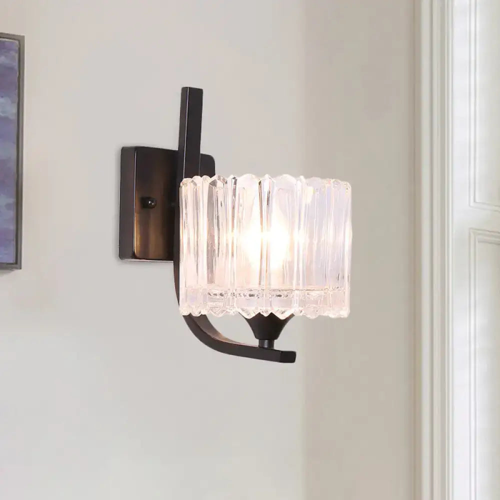 Black crystal drum wall sconce with ribbed glass shade and dark metal mount on Tampa Home & Garden Store
