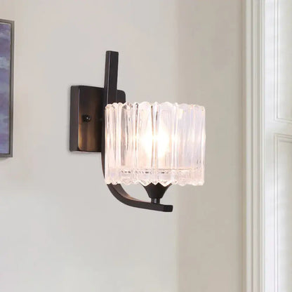 Black crystal drum wall sconce with ribbed glass shade and dark metal mount on Tampa Home & Garden Store