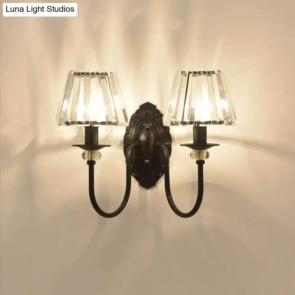 Black crystal drum-shaped wall sconce by Decorbites with curved arms and crystal shade on Tampa Home & Garden Store