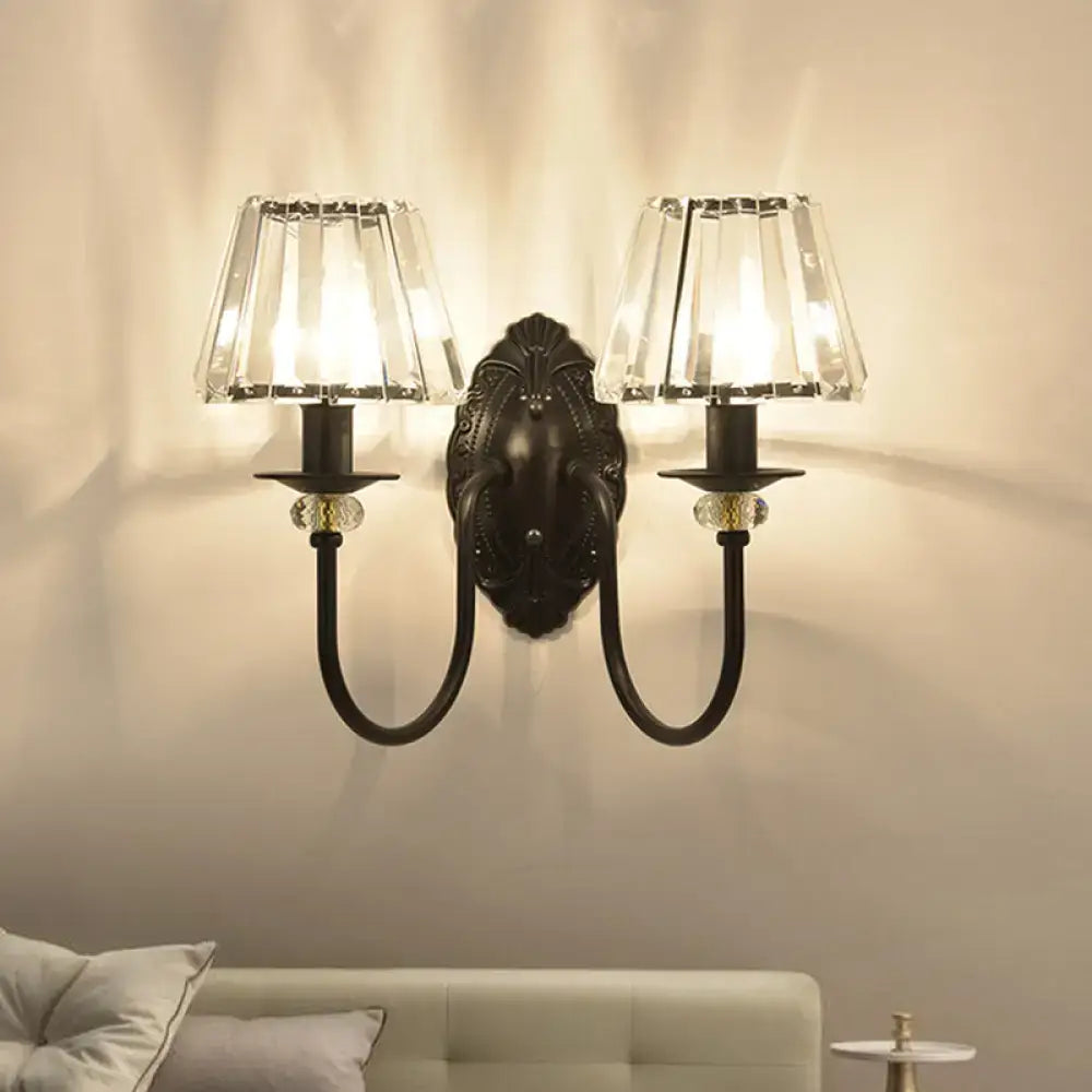 Two-light black crystal drum sconce with backplate and crystal shade panels on metal arms on Tampa Home & Garden Store
