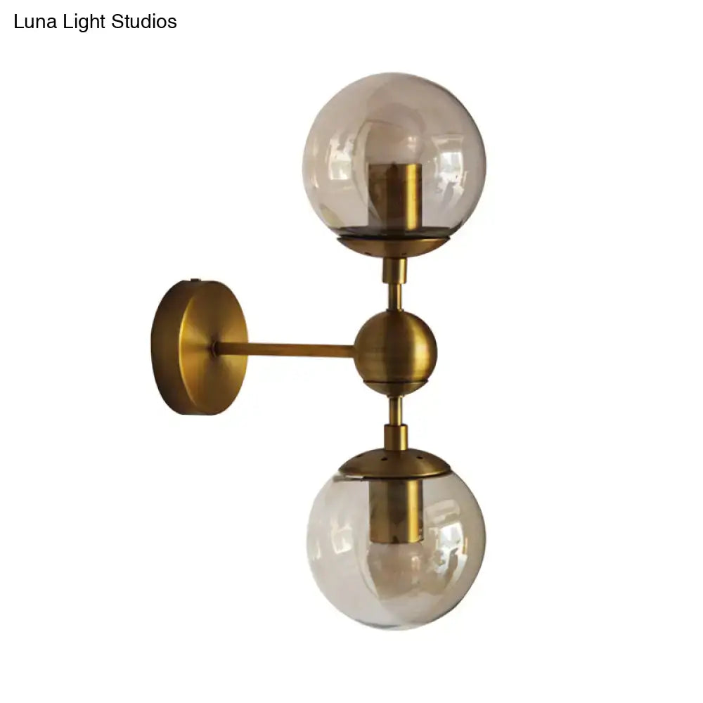 Brass amber globe wall sconce with dual glass globes and brass mounting arm Decorbites on Tampa Home & Garden Store