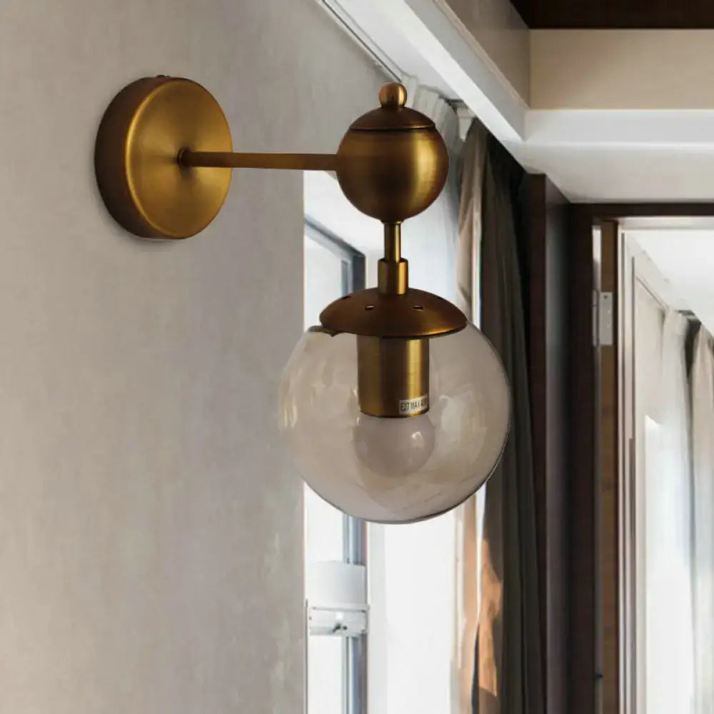 Brass amber globe sconce with clear glass globe and round backplate Decorbites on Tampa Home & Garden Store
