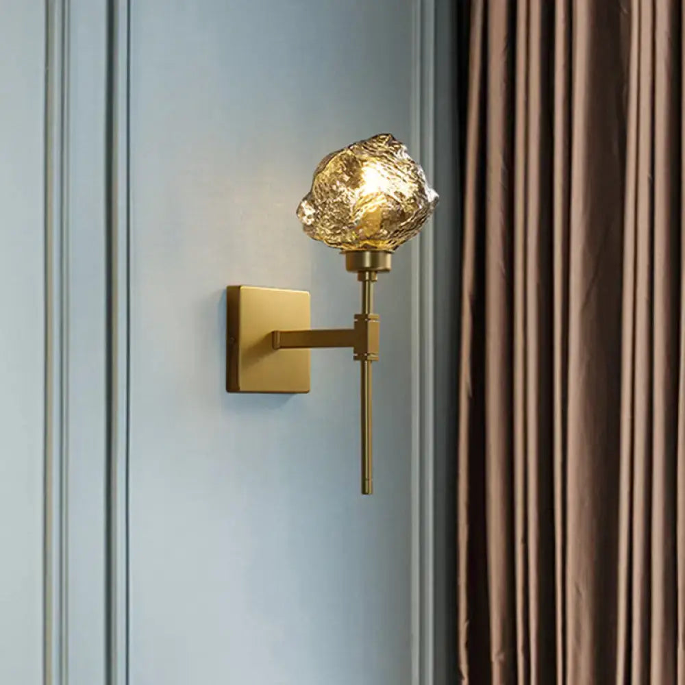Brass amber glass compact sconce by Decorbites on blue wall on Tampa Home & Garden Store