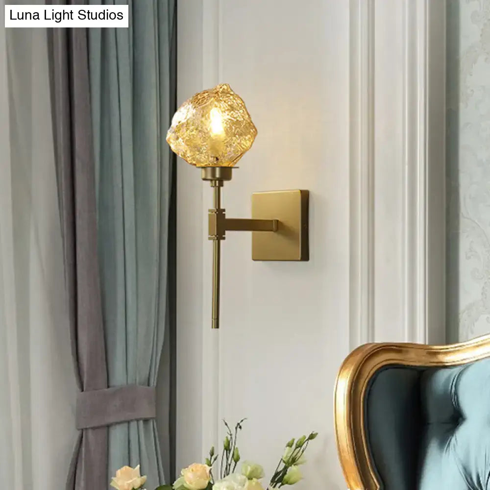 Brass amber glass compact sconce with square backplate by Decorbites on the wall on Tampa Home & Garden Store