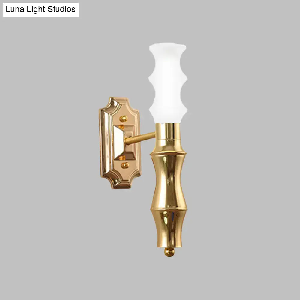 Decorbites brass bamboo wall sconce with frosted glass shade on Tampa Home & Garden Store