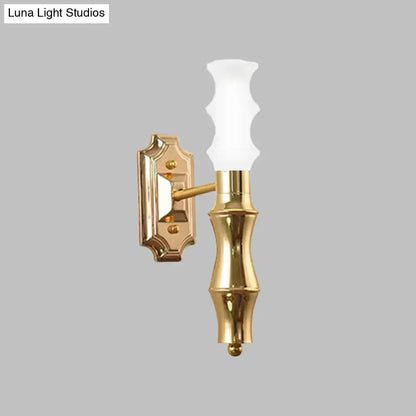 Decorbites brass bamboo wall sconce with frosted glass shade on Tampa Home & Garden Store