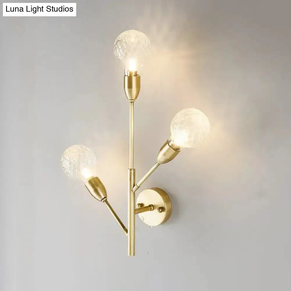 Post-modern brass wall light fixture with four clear lattice glass bulbs for bedroom decor on Tampa Home & Garden Store