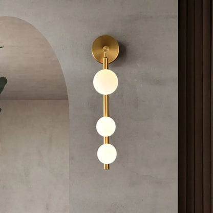 Gold Glass Industrial G9 Wall Sconce with three frosted glass globes on brass rod Decorbites on Tampa Home & Garden Store