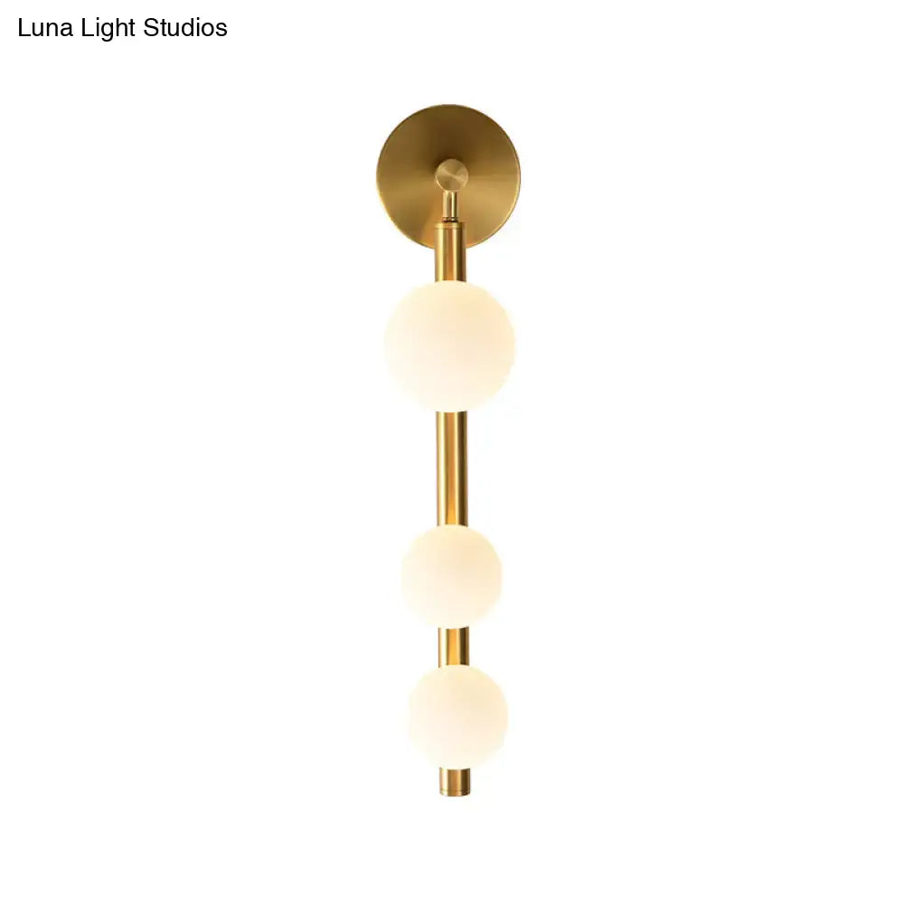 Gold Glass Industrial G9 Wall Sconce by Decorbites with three glass spheres on a gold rod on Tampa Home & Garden Store