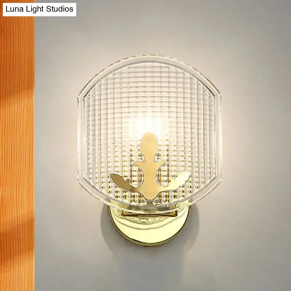 Gold lattice glass wall sconce by Decorbites with clear shade and fleur-de-lis brass accent on Tampa Home & Garden Store