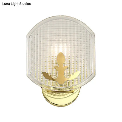 Gold lattice glass wall sconce with brass base and fleur-de-lis accent by Decorbites on Tampa Home & Garden Store