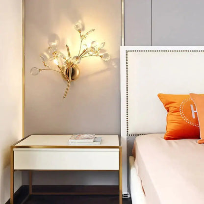 Gold Crystal Branch Sconce lamp with crystal globes by Decorbites above a nightstand on Tampa Home & Garden Store